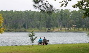 A family relaxes on the shore of Karick Lake